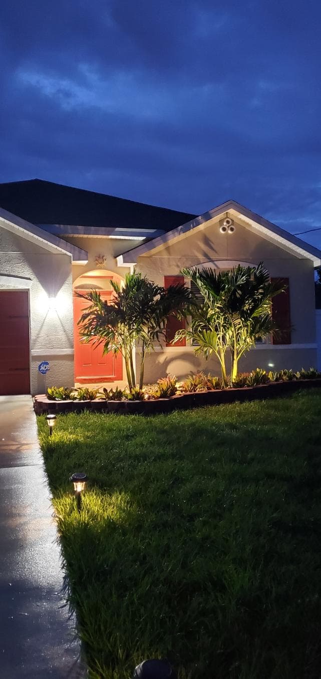 Domi Landscape professional team working on a South Florida property