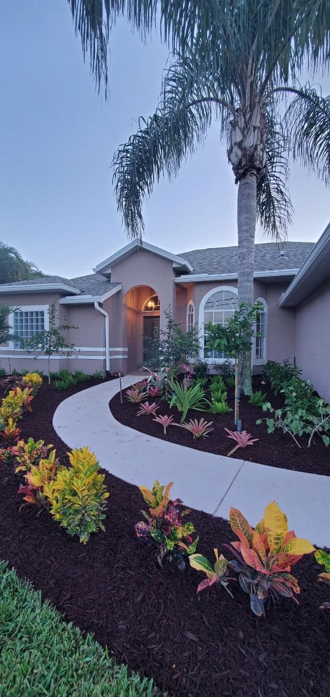 Residential lawn maintenance by Domi Landscape in West Palm Beach